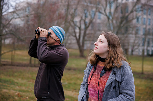 Picture of Alex looking for Robins with an undergraduate assistant