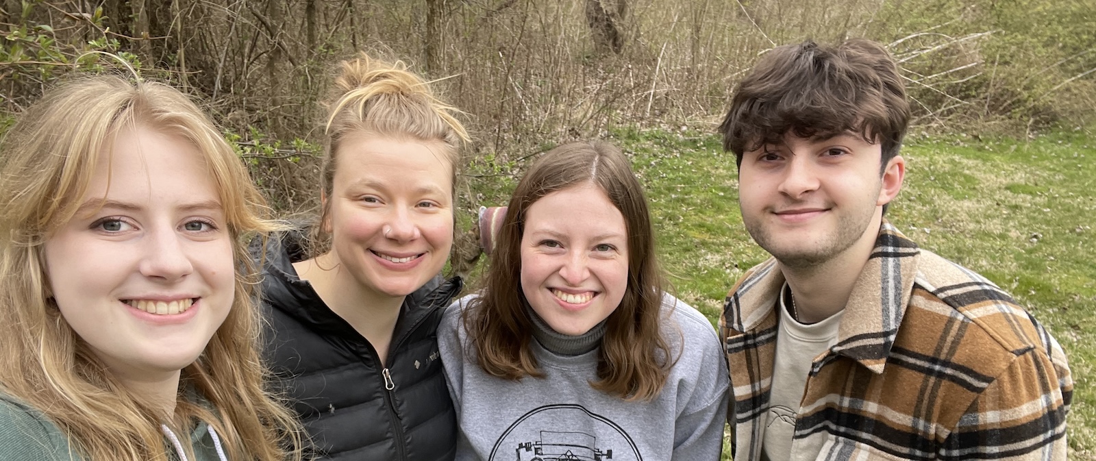 A group of four researchers smile at the camera